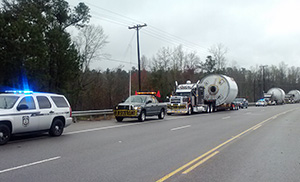 pilot car leading load down the road